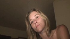Trashy young blonde Kerri loses her clothes and milks a throbbing pole