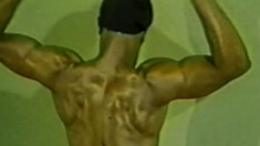 Very muscled black man works his huge hard meat with both hands